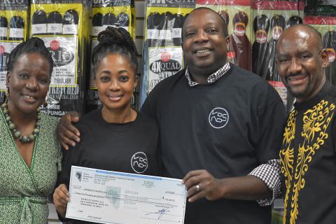ADC loan check to KIN Beauty Esther and Utibe Inwek receive ADC loan for KIN Beauty